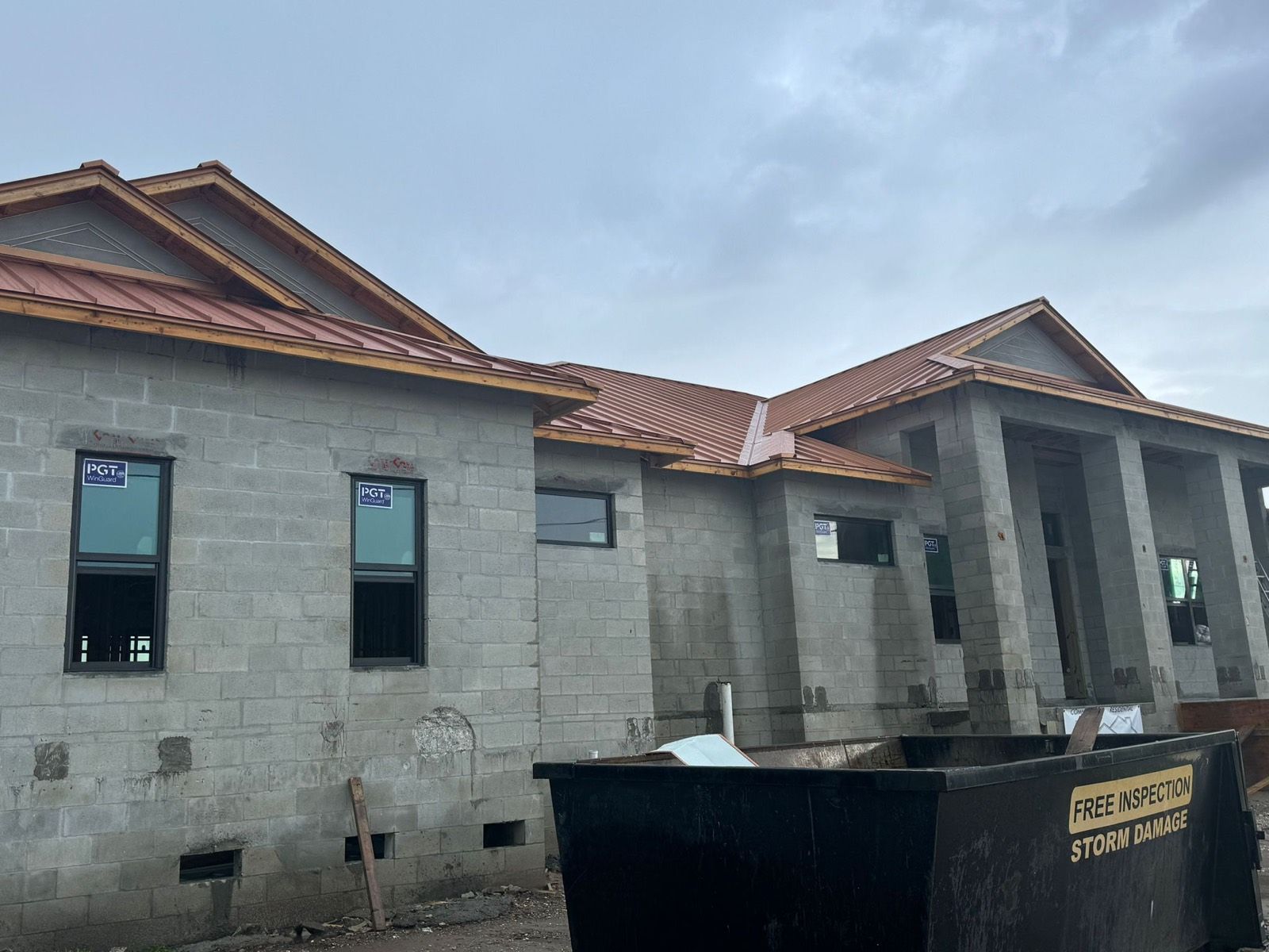 Copper-Tone Metal Roof on a New Block Home