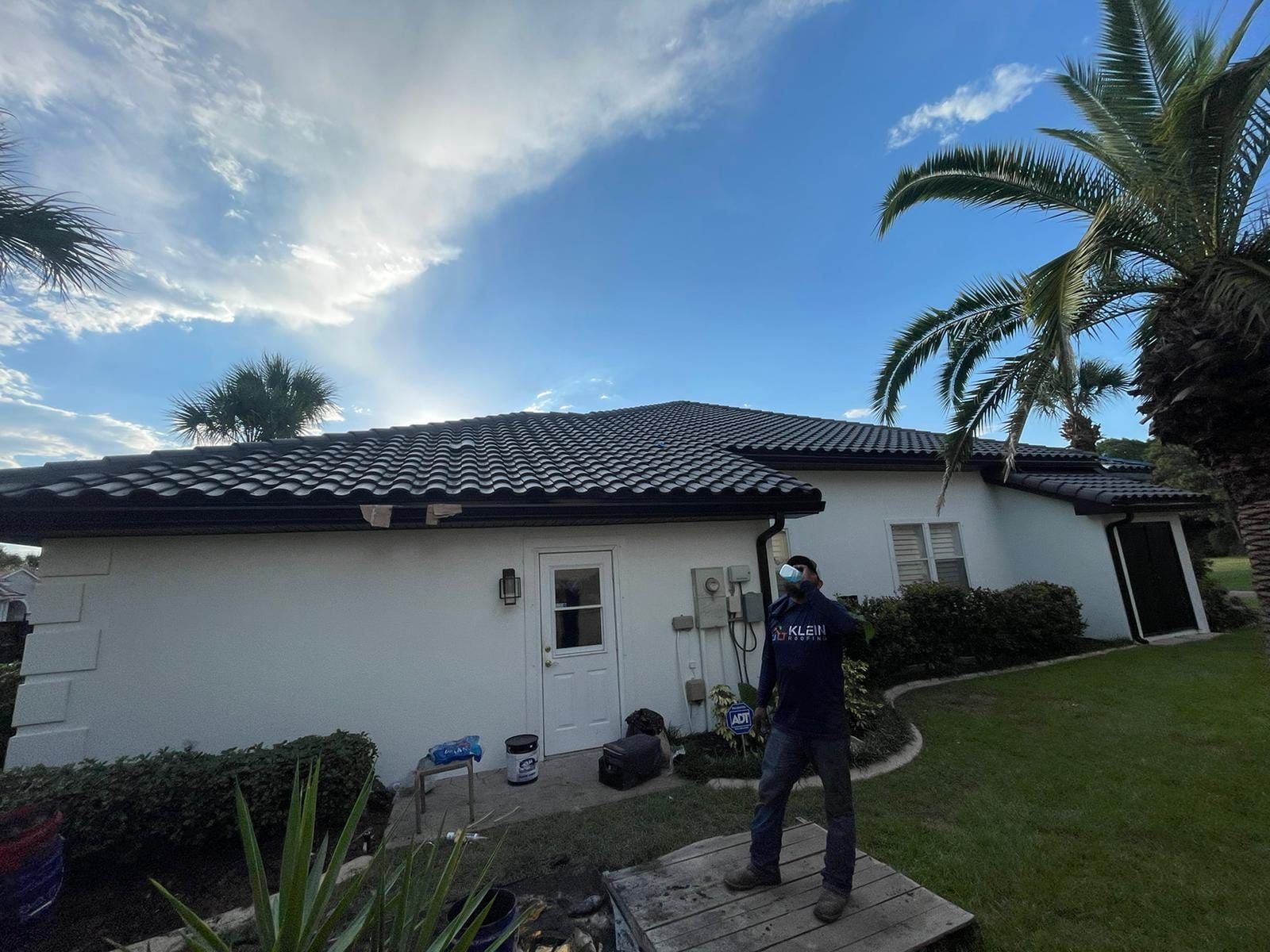 Looking over a tile roof from the ground before going up
