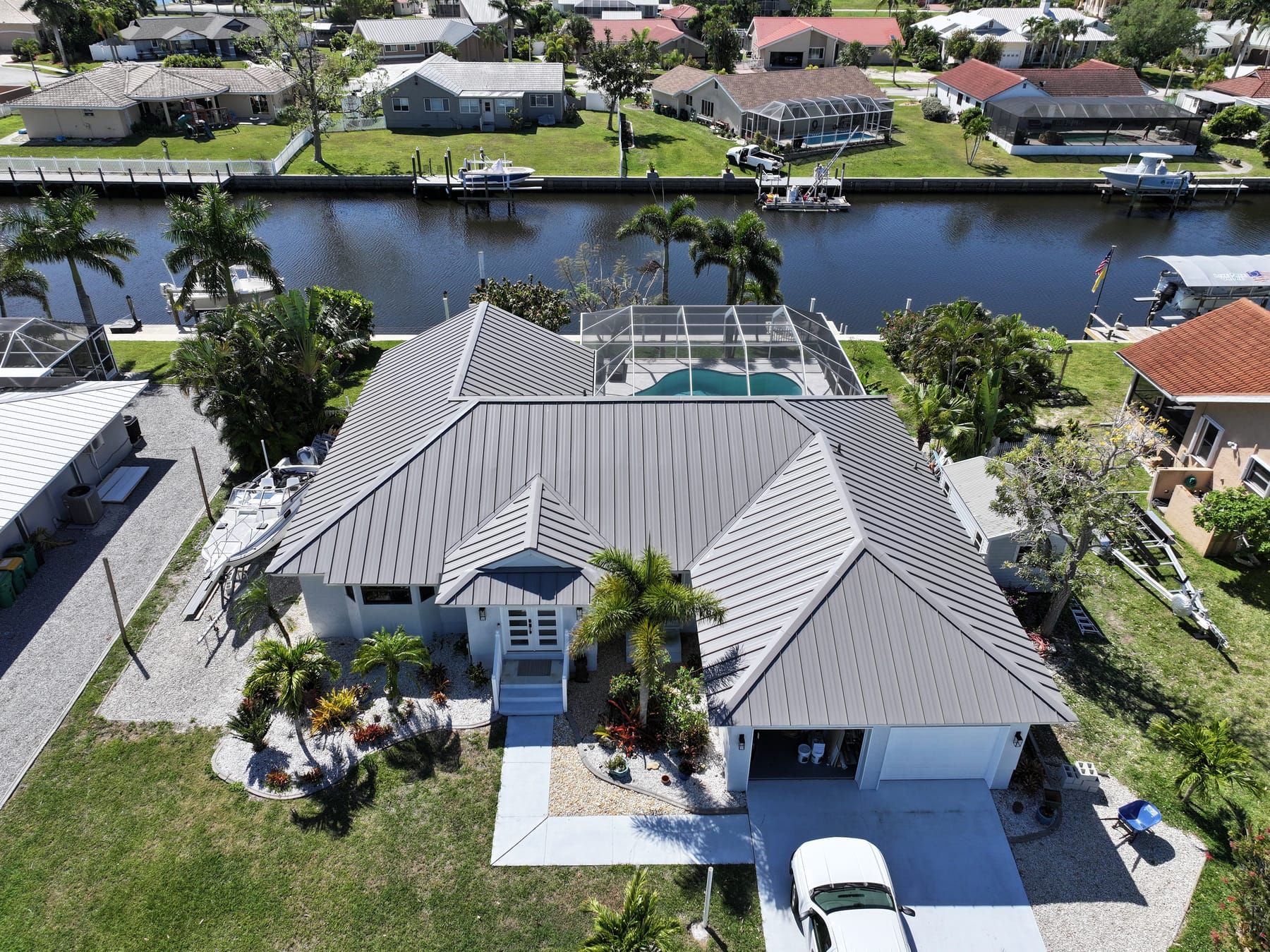 Gray metal roof on a canal home in Port Charlotte